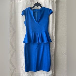 Royal blue sleeveless dress with a ruffle at the waist.